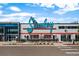Exterior view of Stanley Marketplace, showcasing vibrant storefronts and a lively atmosphere for shopping and dining at 2867 Jasmine St, Denver, CO 80207