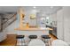 Modern kitchen with butcher block countertops, stainless steel appliances, and bar seating for casual dining at 2867 Jasmine St, Denver, CO 80207