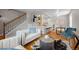 Stylish living room showcasing hardwood floors, modern furniture, and an open floor plan with kitchen access at 2867 Jasmine St, Denver, CO 80207
