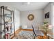 Stylish home office setup with modern furniture, a decorative rug, and ample shelving for storage and decor at 2867 Jasmine St, Denver, CO 80207