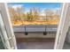 Balcony view overlooking a park and trees near a lake at 1694 Quitman St, Denver, CO 80204