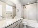 Modern bathroom with a bathtub, shower, and updated vanity at 1694 Quitman St, Denver, CO 80204