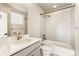 Stylish bathroom with patterned tile and updated fixtures at 1694 Quitman St, Denver, CO 80204