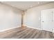 Large bedroom with wood-look floors and an adjoining bathroom at 1694 Quitman St, Denver, CO 80204