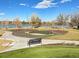 Community skate park with smooth ramps and a lake view at 1694 Quitman St, Denver, CO 80204