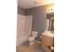 Full bathroom with tiled floor, tub and shower, single sink vanity, and toilet at 7982 S Kittredge Way, Englewood, CO 80112
