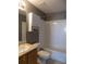Full bathroom with tiled tub and shower, single sink vanity, and toilet at 7982 S Kittredge Way, Englewood, CO 80112