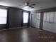 Large bedroom featuring two windows, wood floors, and wall closet at 7982 S Kittredge Way, Englewood, CO 80112