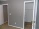 Bedroom view showcasing neutral walls and trim with a closet for storage at 7982 S Kittredge Way, Englewood, CO 80112