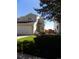 Charming townhome with a well-manicured lawn, attached garage, and inviting front porch at 7982 S Kittredge Way, Englewood, CO 80112
