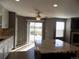 Bright kitchen with granite countertops, stainless steel appliances, and sliding glass doors to the backyard at 7982 S Kittredge Way, Englewood, CO 80112