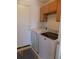 Convenient laundry room with washer, dryer, and ample cabinet storage at 7982 S Kittredge Way, Englewood, CO 80112