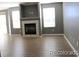 Spacious living room with a fireplace and modern flooring at 7982 S Kittredge Way, Englewood, CO 80112