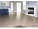 Open-concept living room featuring a cozy fireplace at 7982 S Kittredge Way, Englewood, CO 80112