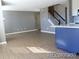 Open concept living space with stairs and kitchen island at 7982 S Kittredge Way, Englewood, CO 80112