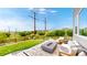 Backyard patio area with comfortable seating and a modern gas fire pit at 4585 High Mesa Cir, Castle Rock, CO 80108