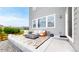 Backyard patio area with comfortable seating and a modern gas fire pit at 4585 High Mesa Cir, Castle Rock, CO 80108
