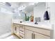 Bathroom featuring double sinks, a large mirror, modern fixtures, and a glass shower at 4585 High Mesa Cir, Castle Rock, CO 80108