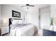 Contemporary bedroom features a ceiling fan, closet, and minimalist decor creating a peaceful retreat at 4585 High Mesa Cir, Castle Rock, CO 80108