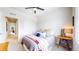 Comfortable bedroom with natural light features a ceiling fan and closet for optimal storage at 4585 High Mesa Cir, Castle Rock, CO 80108