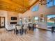 Clubhouse with vaulted ceilings, stone fireplace, and large windows at 4585 High Mesa Cir, Castle Rock, CO 80108