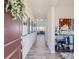 Inviting entryway with modern decor, light wood floors, and a glimpse of the open living space at 4585 High Mesa Cir, Castle Rock, CO 80108