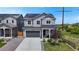 Charming two-story home with grey siding, solar panels, and a well-manicured lawn at 4585 High Mesa Cir, Castle Rock, CO 80108