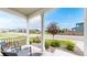 Cozy porch featuring chairs, a rug, and neighborhood views at 4585 High Mesa Cir, Castle Rock, CO 80108