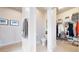 Hallway with a half-bath, walk-in closet, and photos on the wall at 4585 High Mesa Cir, Castle Rock, CO 80108