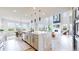 Open concept kitchen with a large island, modern appliances, and a view into the spacious living area at 4585 High Mesa Cir, Castle Rock, CO 80108