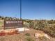 Wrangler Park sign with lush landscaping and clear blue skies at 4585 High Mesa Cir, Castle Rock, CO 80108