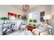 Cozy sitting area with stylish decor, a unique chandelier, and natural light from the window at 4585 High Mesa Cir, Castle Rock, CO 80108
