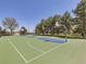 Outdoor basketball court with well-maintained surface and hoops, surrounded by trees, offering a recreational space at 3341 Oneida St, Denver, CO 80207