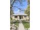 A charming single-story brick home with a well-maintained lawn and walkway to the front door at 3341 Oneida St, Denver, CO 80207