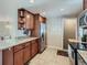 Kitchen boasting granite countertops, stainless steel appliances, and warm wood cabinetry at 3341 Oneida St, Denver, CO 80207