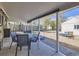 Covered patio with outdoor seating area, providing a relaxing space for entertaining and enjoying the backyard at 3341 Oneida St, Denver, CO 80207
