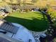 Stunning backyard featuring a manicured lawn, rock garden and stone border at 6610 Barnstead Dr, Castle Pines, CO 80108
