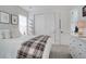 Comfortable bedroom with closet and dresser, featuring a soft bed and muted tones at 6610 Barnstead Dr, Castle Pines, CO 80108