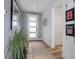Inviting entryway features a modern front door, artwork, and beautiful flooring at 6610 Barnstead Dr, Castle Pines, CO 80108