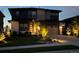 Stunning home with contemporary design, professional landscaping, and outdoor lighting at 6610 Barnstead Dr, Castle Pines, CO 80108