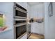 Modern kitchen with stainless appliances and stylish backsplash at 6610 Barnstead Dr, Castle Pines, CO 80108