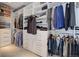 Organized walk-in closet with custom shelving, hanging rods, and drawers, perfect for wardrobe management at 6610 Barnstead Dr, Castle Pines, CO 80108