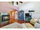 Spacious living room with a fireplace and a high ceiling at 15501 E 112Th Ave # 20C, Commerce City, CO 80022