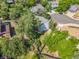 An aerial view showcases a backyard with mature trees and a storage shed, fenced for privacy at 3308 W 11Th Avenue Pl, Broomfield, CO 80020