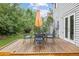 Back deck with an outdoor table and umbrella, great for outdoor entertaining at 3308 W 11Th Avenue Pl, Broomfield, CO 80020