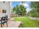 A spacious backyard with a wooden deck, green grass, and a wooden fence perfect for outdoor living and entertaining at 3308 W 11Th Avenue Pl, Broomfield, CO 80020