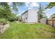 Spacious backyard with a deck, lush green grass, a garden, and a shed at 3308 W 11Th Avenue Pl, Broomfield, CO 80020