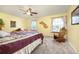 Cozy bedroom with a ceiling fan, windows with curtains and rocking chair at 3308 W 11Th Avenue Pl, Broomfield, CO 80020