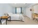 Bright bedroom with a closet and bedside table, with light-blue wall coloring and natural light at 3308 W 11Th Avenue Pl, Broomfield, CO 80020