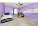 Bright bedroom with large window, whiteboards, ceiling fan, and a cozy desk area at 3308 W 11Th Avenue Pl, Broomfield, CO 80020